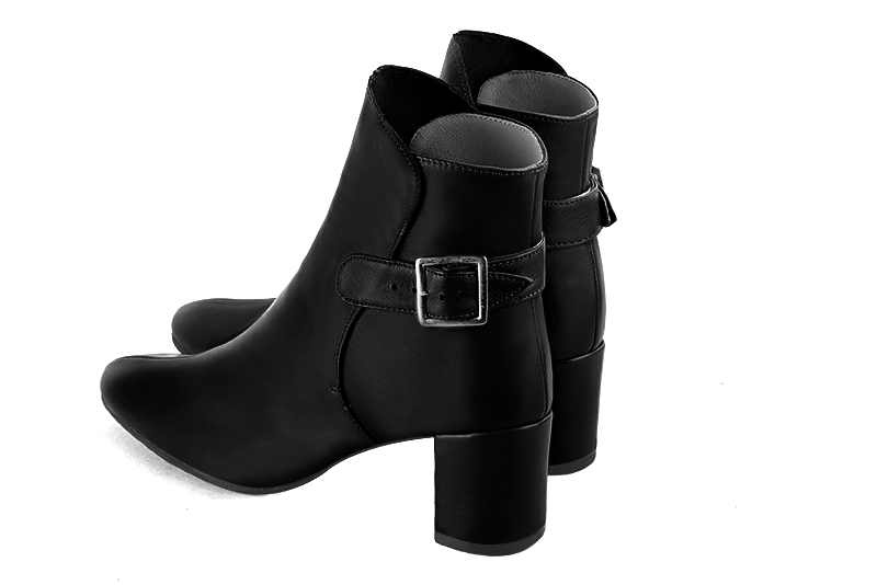 Satin black women's ankle boots with buckles at the back. Round toe. Medium block heels. Rear view - Florence KOOIJMAN